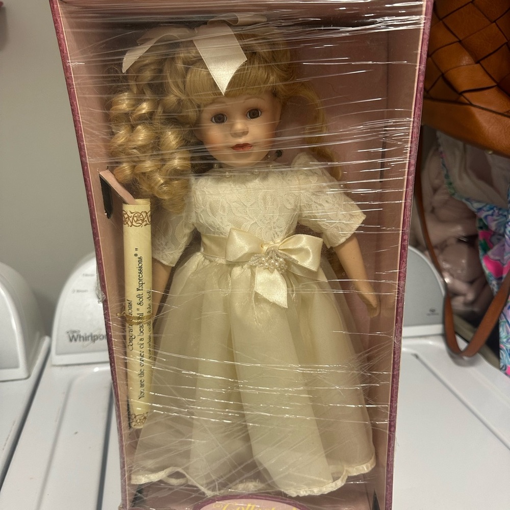 Elegant Cream Doll with Curly Hair